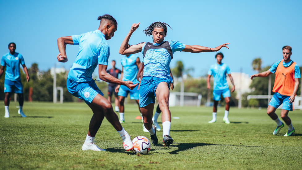 FRIENDLY RIVALRY  : Jahmi Simpson-Pusey and Lakyle Samuel go head-to-head in a fast-paced drill. 