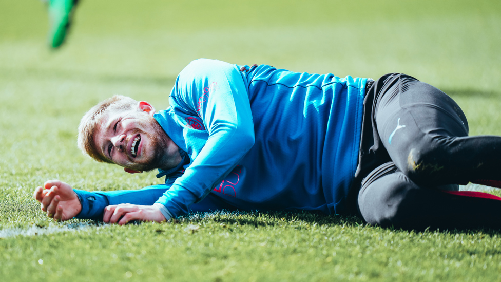 FLAT OUT : De Bruyne takes a breather.