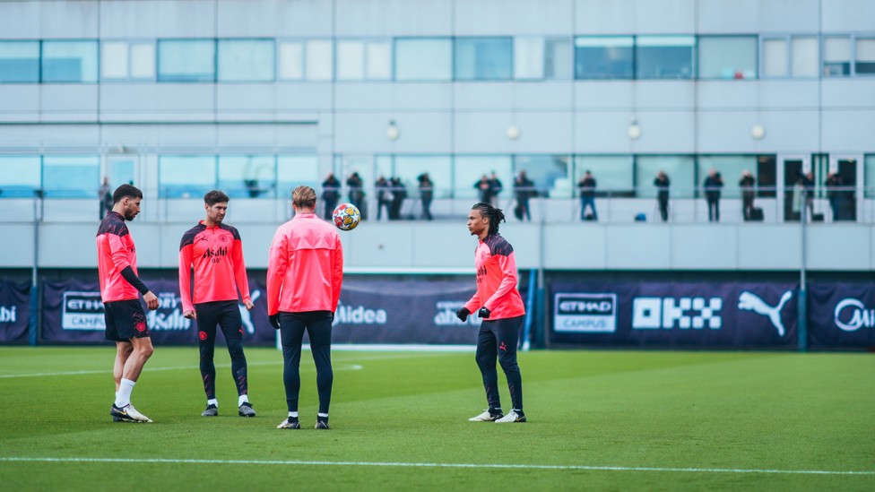 KEEPY UP  : A City quartet juggle the ball. 