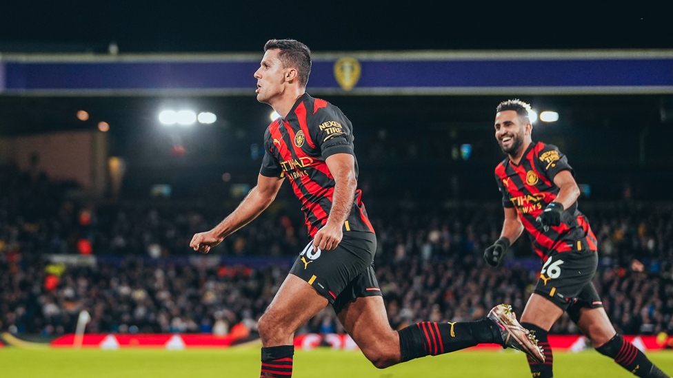 DEADLOCK BROKEN : Rodri wheels away to celebrate his goal in first-half stoppage time.