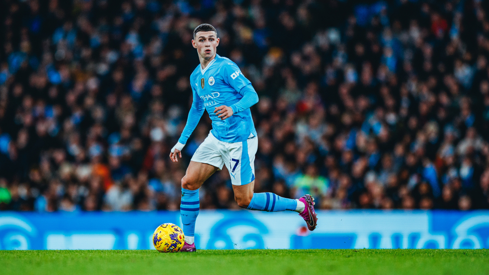 PHIL-ING GOOD : Foden at the heart of a City attack.