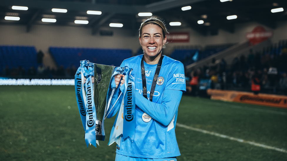 CONTI CUP CHAMPION : Kennedy lifts her first silverware at the Club following our 3-1 success over Chelsea.