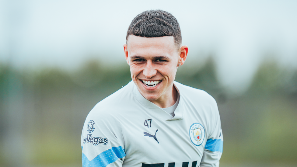 ONE OF OUR OWN : Phil Foden smiling as preparations for Brentford begin.