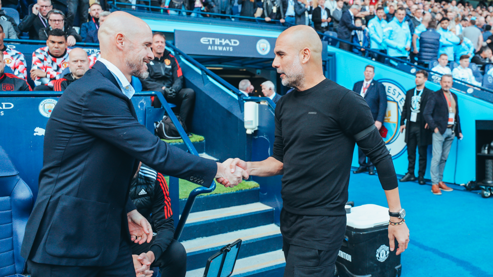 BOSSES : Guardiola and Ten Hag share a warm embrace ahead of kick-off.