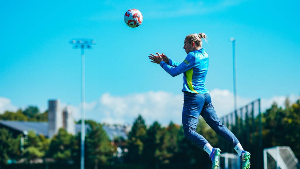 HEADS WE WIN: Alex Greenwood powers in a header.