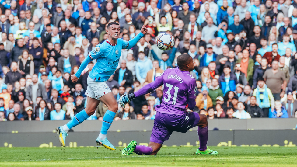 PHIL-ING IT : Foden makes it 2-0 with a delightful dinked finish.