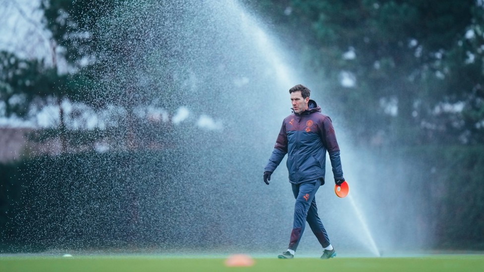 SPRINKLE OF JOY : Gareth Taylor narrowly avoids the sprinklers. 