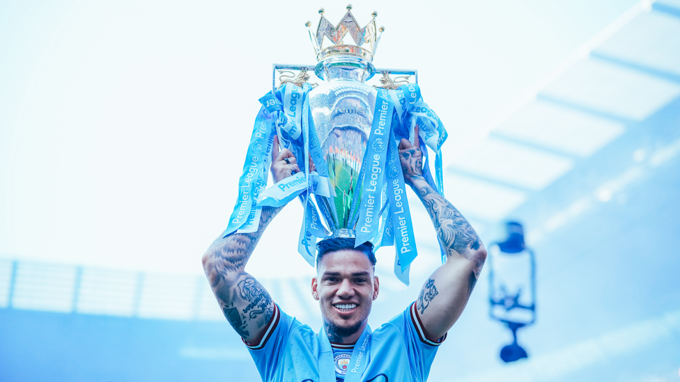 STEADY EDDIE : Who needs a hat when you have the Premier League trophy!