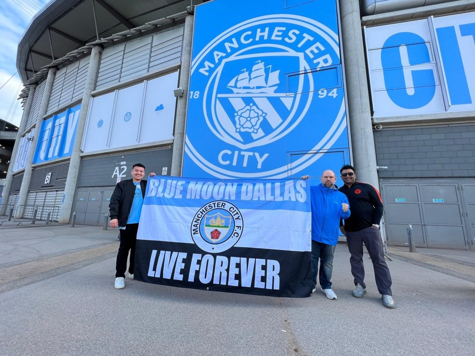  : Blue Moon Dallas with their flag outside the Etihad. 