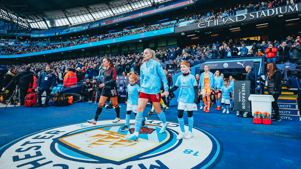 RECORD BREAKER : Greenwood leads the City team out in front of over 44,000 fans at the Etihad Stadium in December 2022