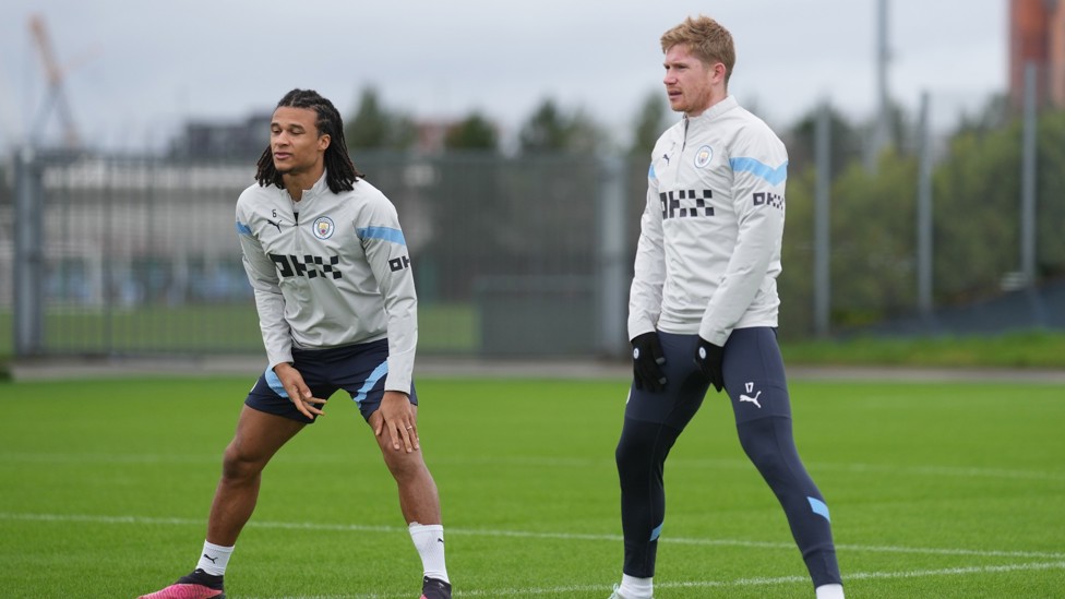 DYNAMIC DUO : Nathan Ake and Kevin De Bruyne stretch ahead of the session