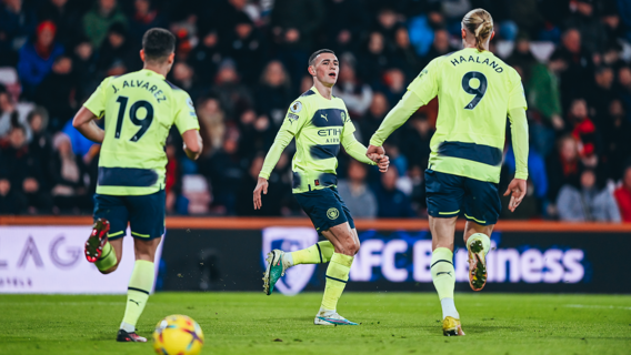 TERRIFIC TRIO: The three goalscorers celebrate.