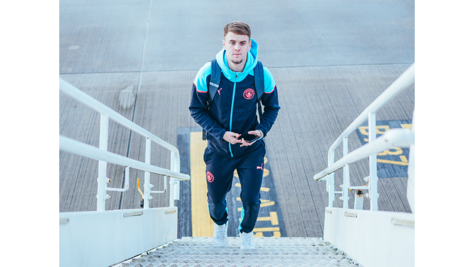 UP FOR IT: Josh Adam prepares to board the plane