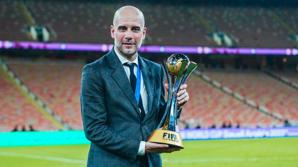 GENIUS  : The man behind the success, Pep Guardiola, with the Club World Cup trophy. 