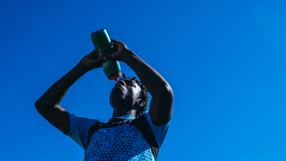 THIRSTY WORK: Stephen Mfuni takes a well earned breather