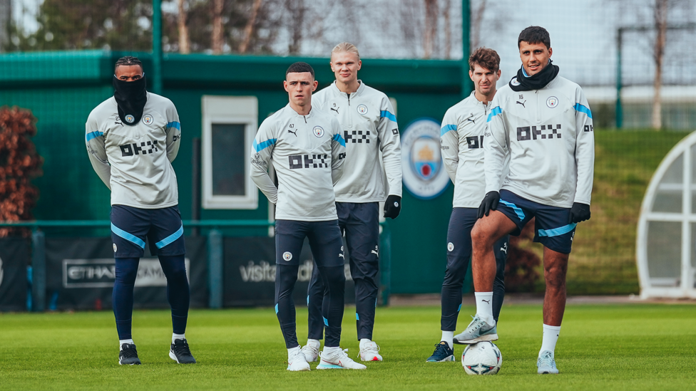 SQUAD GOALS : The players wait their turn for a crack at goal