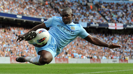 TRUE BLUE: Micah Richards in the thick of the action during his City career