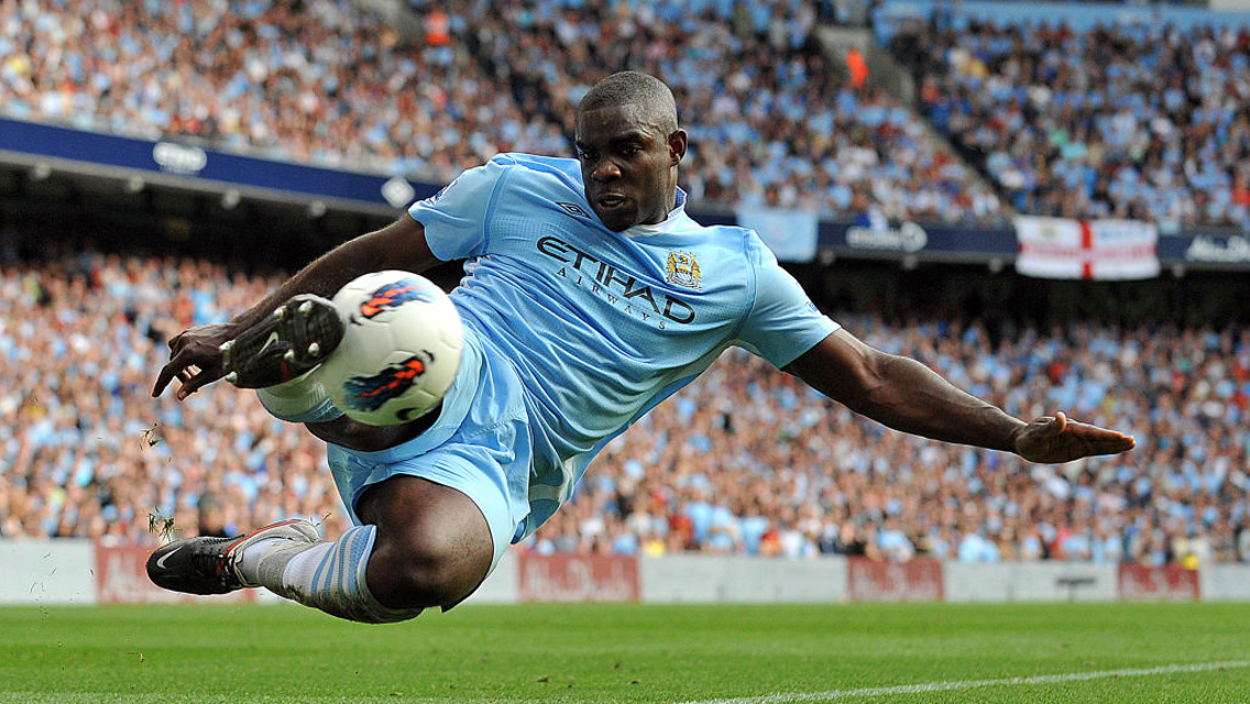 TRUE BLUE: Micah Richards in the thick of the action during his City career