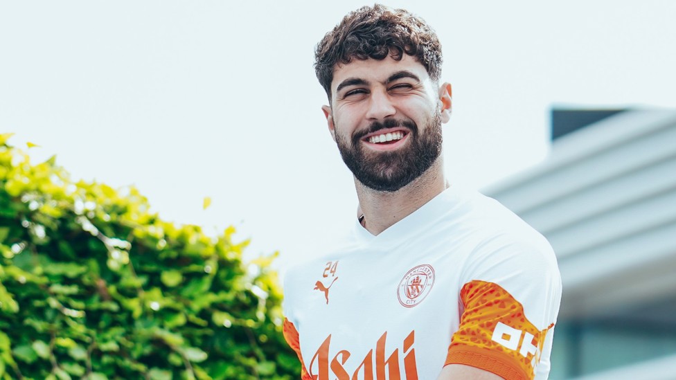 JOYFUL JOSKO : Our in-form defender flashes a smile for the cameras ahead of training