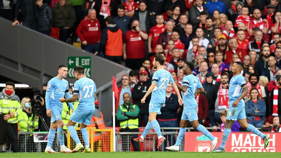 STAR MAN : The players rush to Foden to celebrate his superb equaliser.