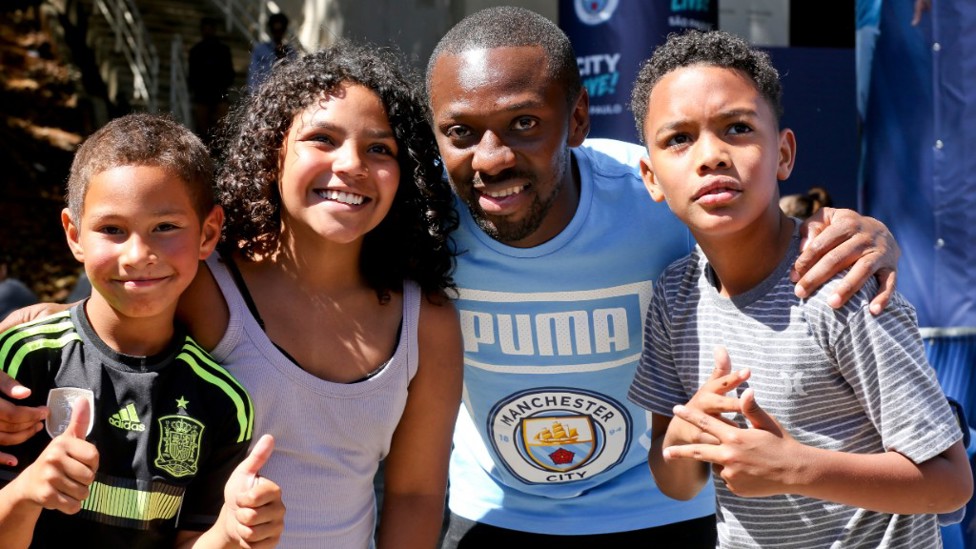 JUNIOR BLUES : Big smiles from Shaun Wright-Phillips and some young fans in Brazil.