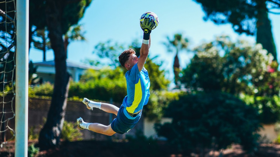 HIGH FLIER: Jack Wint takes to the skies to produce a superb save.