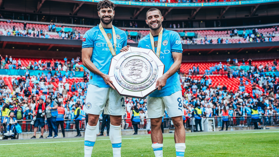 CROATIAN COMPATRIOTS : Kovacic and Gvardiol hold the trophy.