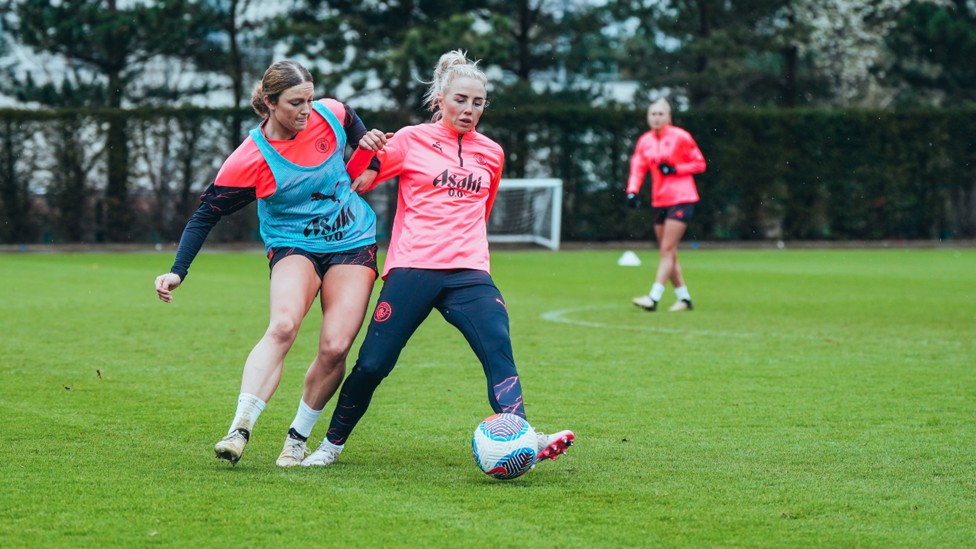 ACTION STATIONS: Ruby Mace and Alex Greenwood vie for possession.