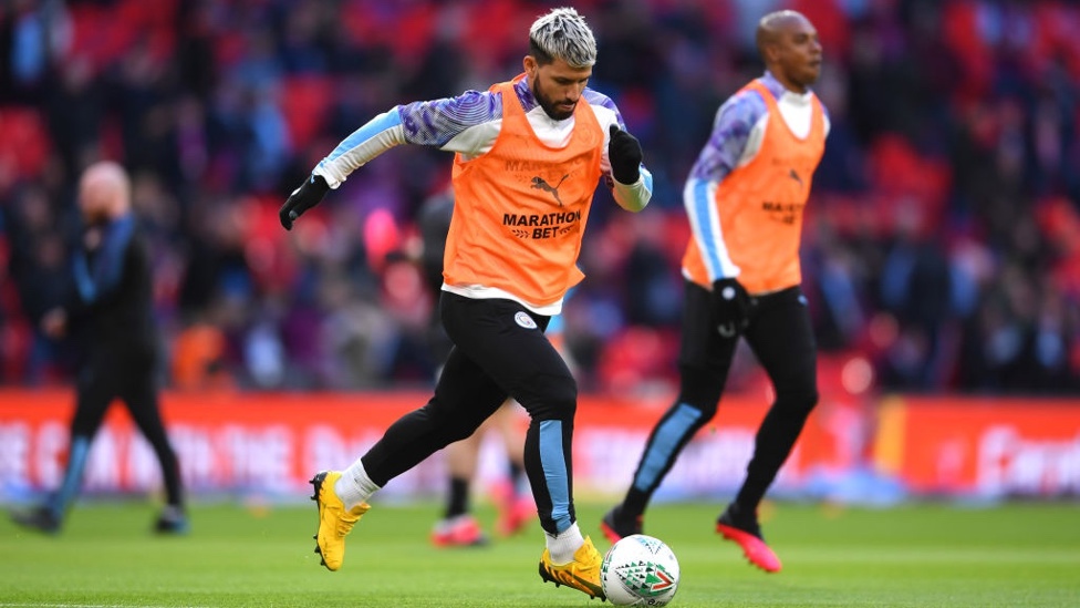 EYES ON THE PRIZE : Aguero gets a feel for the ball ahead of kick-off.