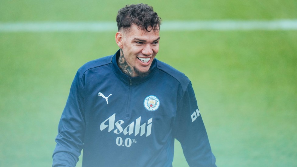 SAFE HANDS  : Ederson keeps his eye on the ball. 