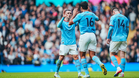 HIGH FIVES: Rodri celebrates with Foden.