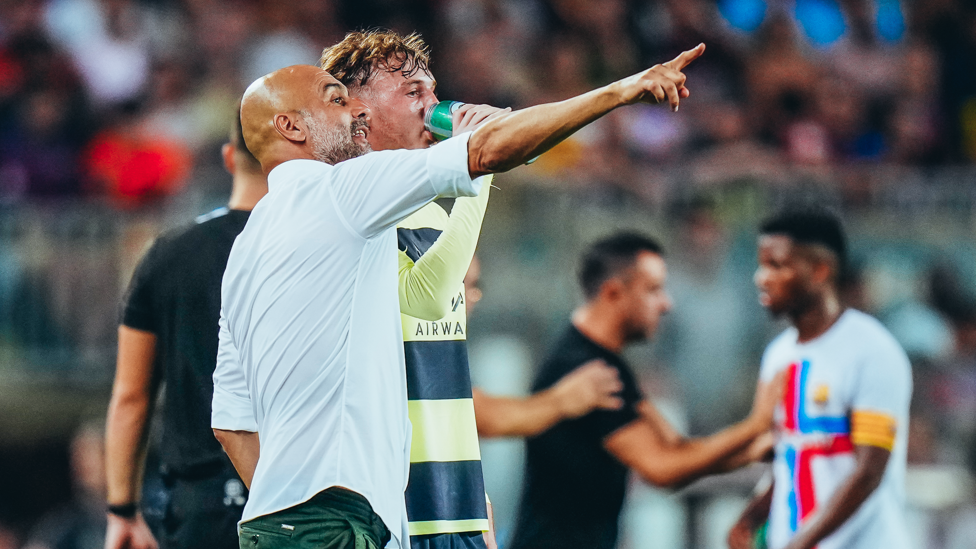 LEARNING FROM THE BEST : Palmer listening intently to Pep Guardiola during a pre-season game in August 2022. 