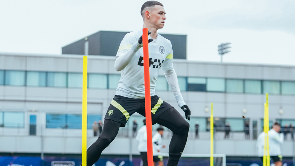 FLYING FODEN : Phil Foden weaves through the posts 