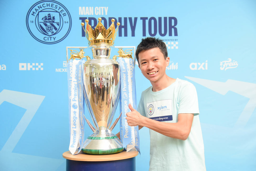 Dream come true : Ken, one of the Young Leaders in KL, poses for a photo with the trophy