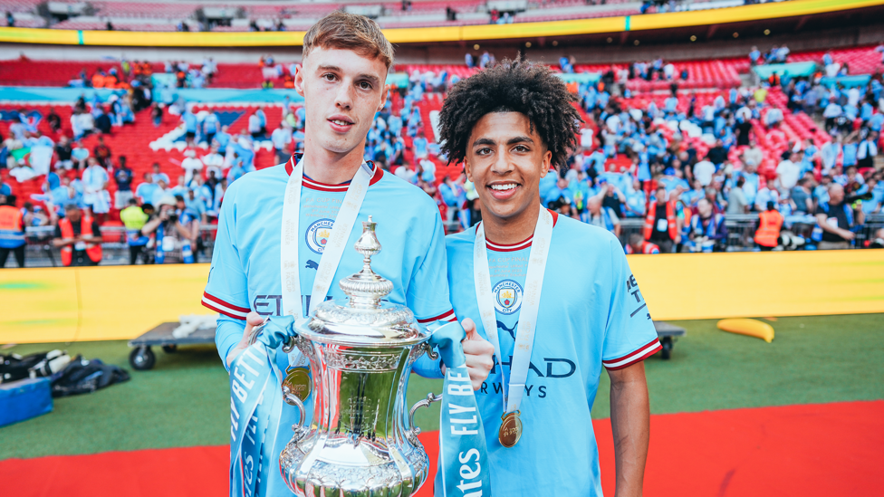 ACADEMY STARS : Palmer and Lewis show off the trophy.