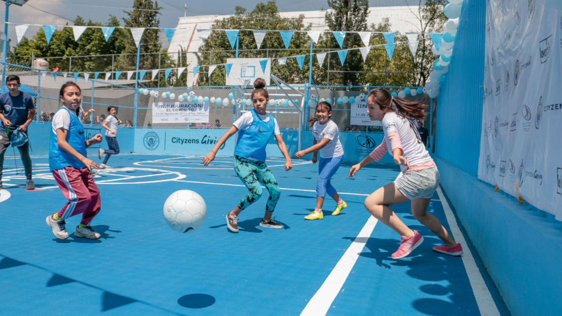 ACTION STATIONS: Youngsters in Mexico City play on the pitch which was opened by Young Leaders