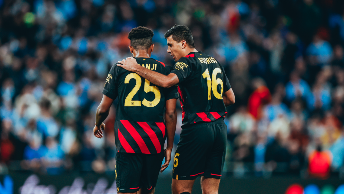 RESHUFFLE: Rodri speaks with Akanji as City reshuffle after the red card.