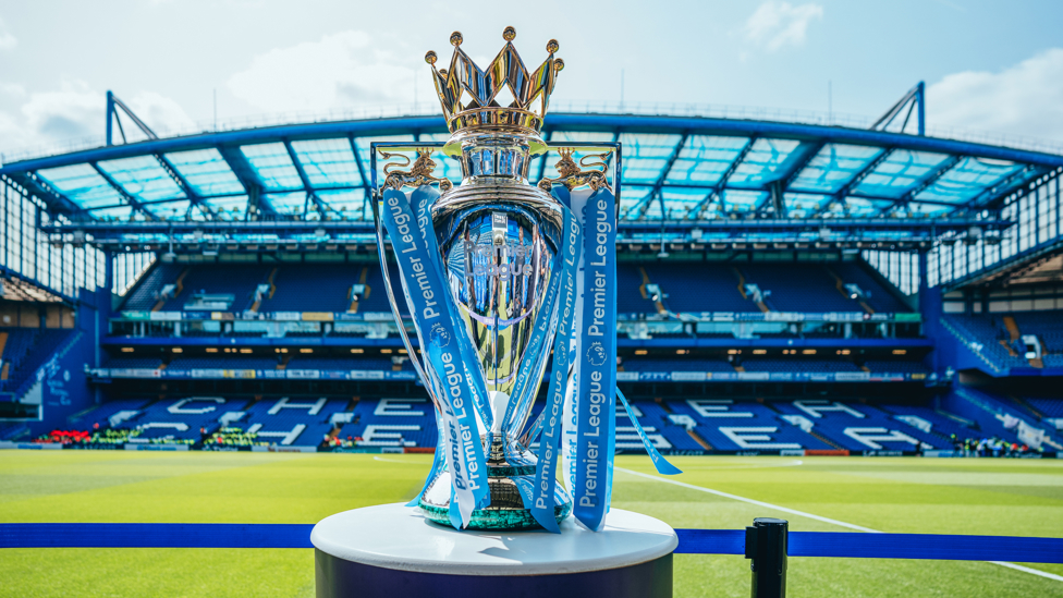 SPECIAL GUEST : Our Premier League trophy glistens in the sunshine at Stamford Bridge.