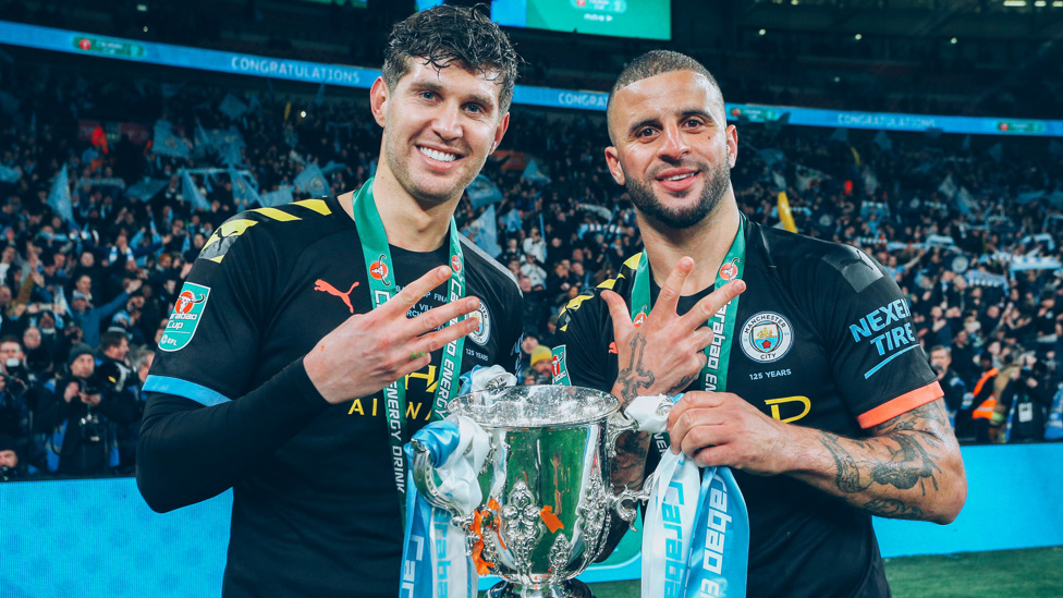 THREE IS A MAGIC NUMBER: The England international celebrates a third successive Carabao Cup triumph with Kyle Walker in March 2020.