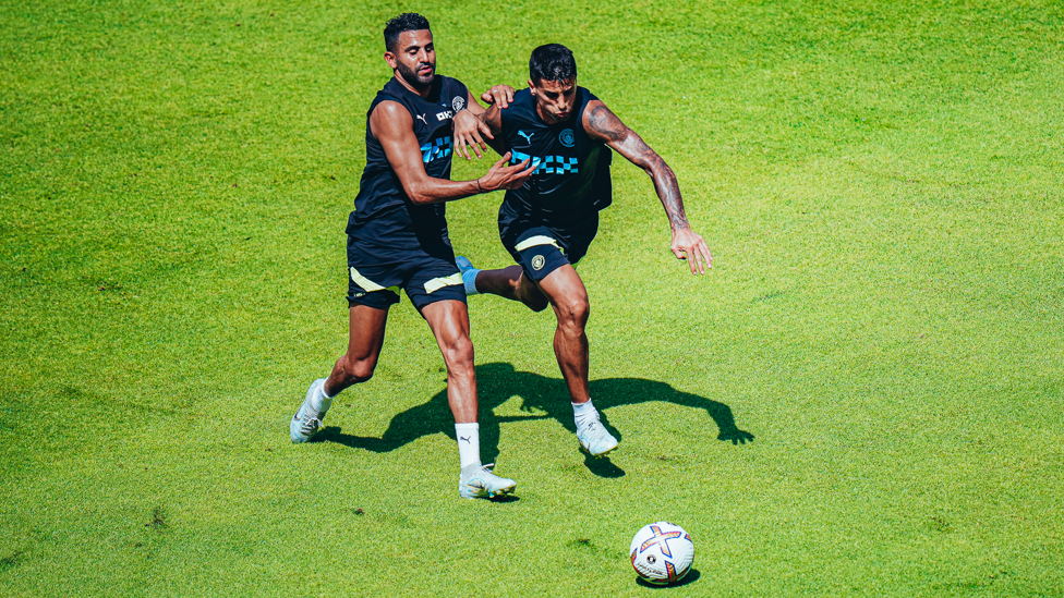 ACTION MEN: Riyad Mahrez and Joao Cancelo vie for possession