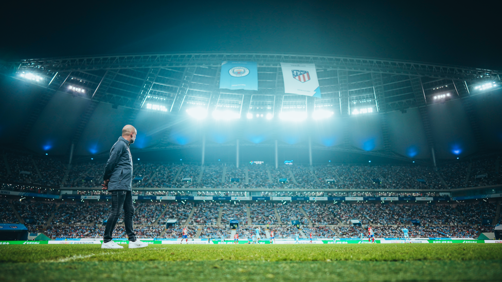 IN THE SPOTLIGHT : Pep Guardiola watches the action