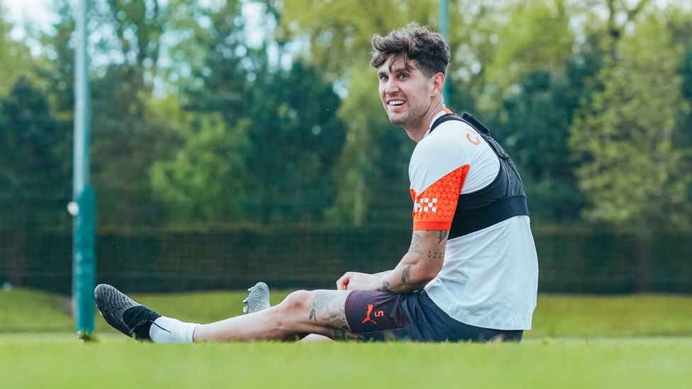 A QUICK BREAK : John Stones takes a quick seat on the CFA pitches.