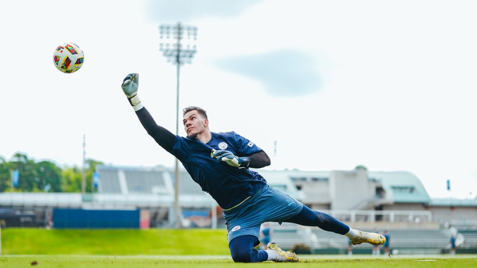 SAFE HANDS : Ederson reaches for the ball