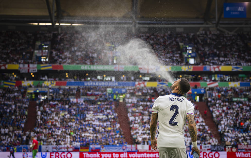 MIST-IFYING : Kyle Walker sprayed his drink in the air after England's triumph over Slovakia.