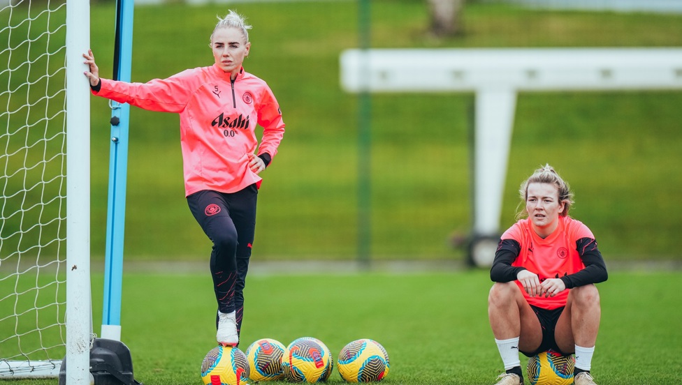 Alex Greenwood and Lauren Hemp  take a breather