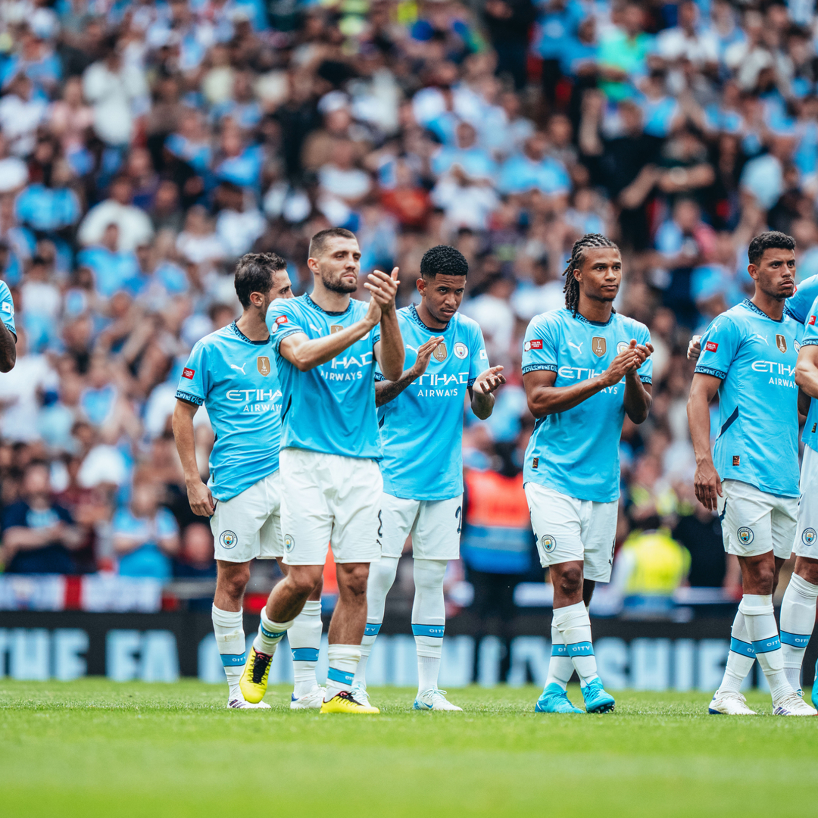 APPLAUD: The players react to Ederson's save.