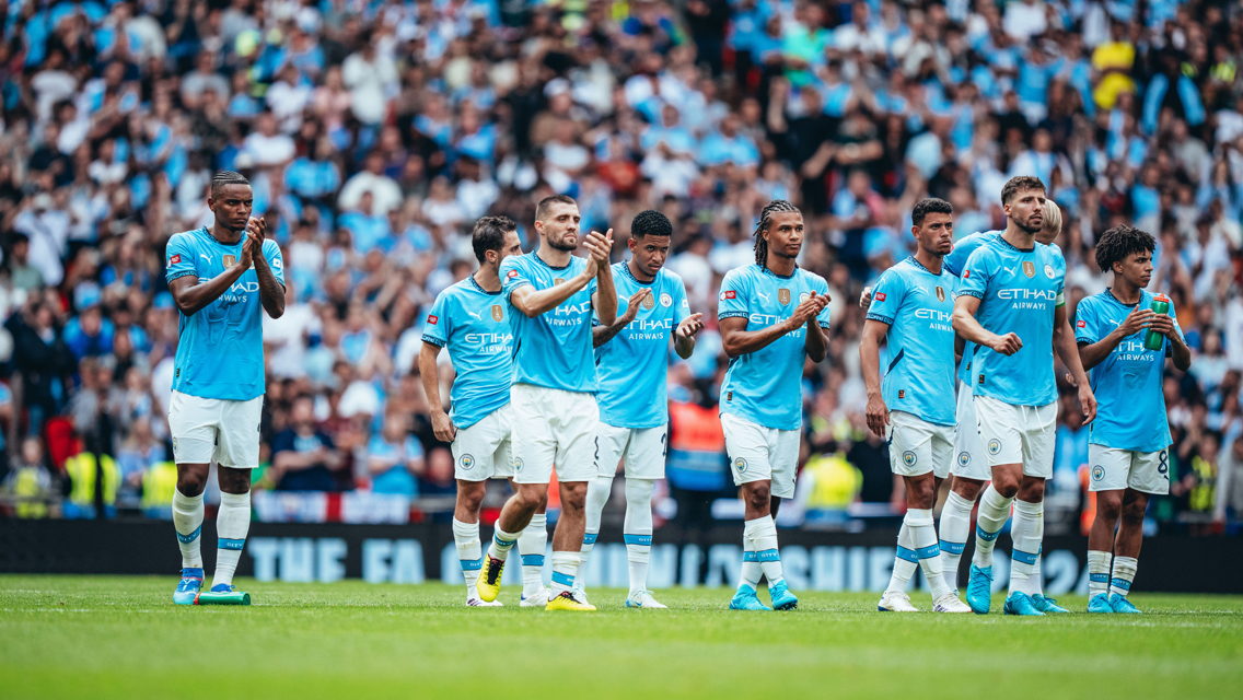 APPLAUD: The players react to Ederson's save.