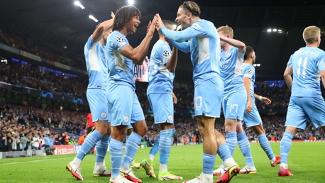 CREATOR+SCORER: Ake and Grealish celebrate City's first goal of this season's UCL campaign.