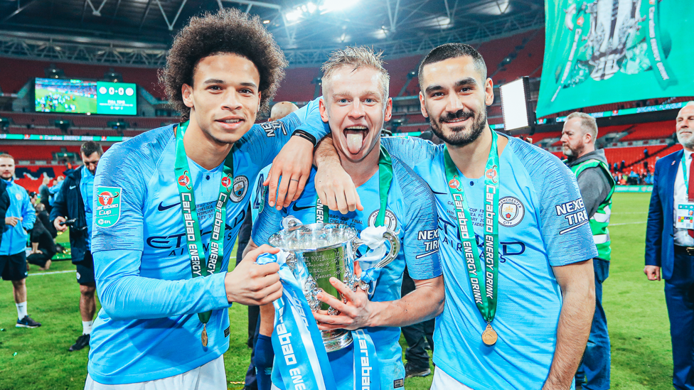 TREBLE YELL: Zinchenko, Leroy Sane and Ilkay Gundogan celebrate after our 2019 Carabao Cup final triumph over Chelsea