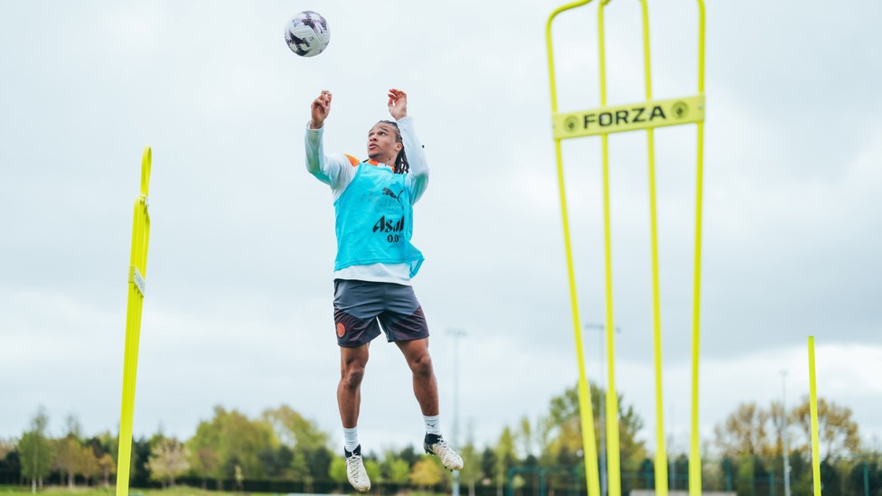 GET UP : Nathan Ake jumps high to head the ball